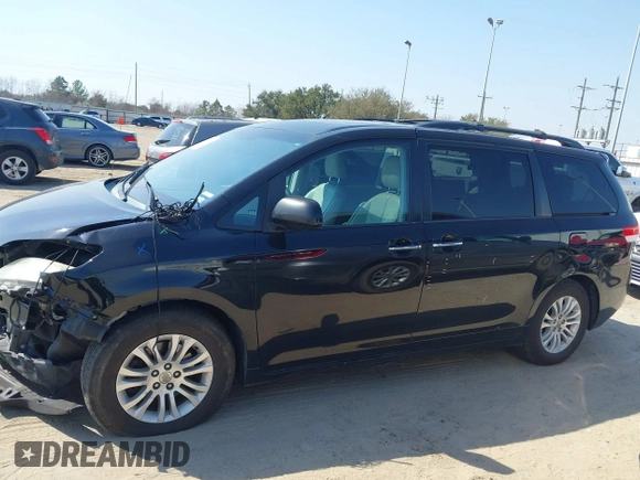 2014 Toyota Sienna XLE with VIN 5TDYK3DC2ES492554, listed as a IAAI auction lot 41685109 with 196,619 mi miles and . Bid and sale history available at DreamBid. Image 14.
