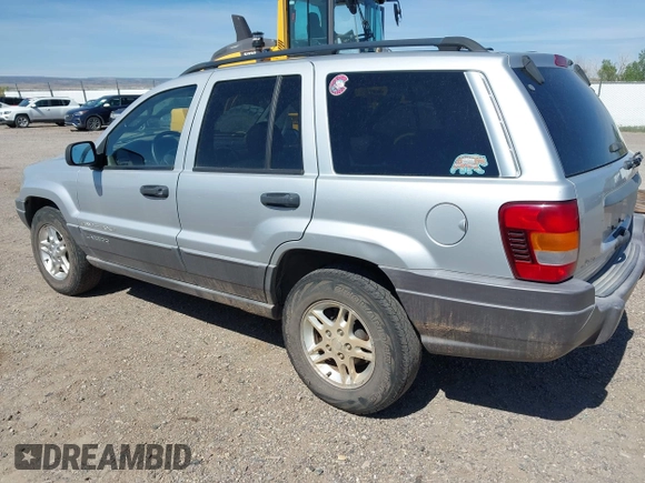2002 Jeep Grand Cherokee Laredo with VIN 1J4GX48S52C249574, listed as a IAAI auction lot 42458883 with 89,028 mi miles and . Bid and sale history available at DreamBid. Image 3.