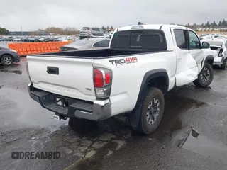 2021 Toyota Tacoma 4WD SR5 with VIN 3TMDZ5BN6MM108851, listed as a IAAI auction lot 41513057 with 25,261 mi miles. Bid and sale history available at carsss.com. Image 4.
