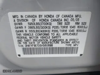 2005 Honda Pilot EX-L with NAVI with VIN 2HKYF18705H560698, listed as a IAAI auction lot 41219235 with 44,448 mi miles. Bid and sale history available at carsss.com. Image 9.