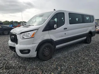 2021 Ford Transit Passenger XL z VIN 1FBAX2Y85MKA50333, wystawiony jako Copart lot #59499755 z przebiegiem 90 142 mil mil oraz Czysty tytuł • Clean title. Historia ofert i sprzedaży dostępna na DreamBid. Obrazek 1.