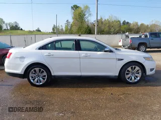 2012 Ford Taurus Limited z VIN 1FAHP2FW1CG103595, wystawiony jako IAAI lot #41913906 z przebiegiem 308 496 mil mil oraz . Historia ofert i sprzedaży dostępna na DreamBid. Obrazek 13.