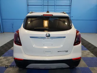2019 Buick Encore Essence with VIN KL4CJGSM0KB895977, listed as a Copart auction lot 68799364 with 57,052 mi miles and Clean Title. Bid and sale history available at DreamBid. Image 6.
