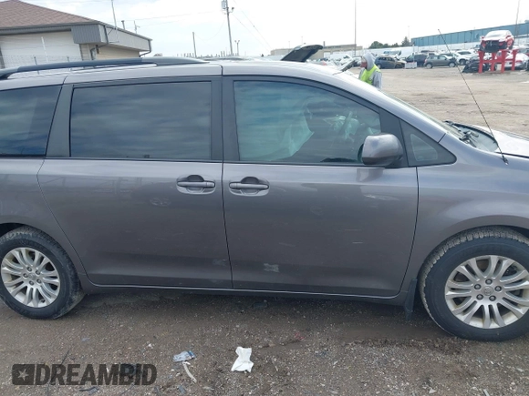 2014 Toyota Sienna XLE with VIN 5TDYK3DC4ES463315, listed as a IAAI auction lot 42108050 with 197,140 mi miles. Bid and sale history available at carsss.com. Image 13.
