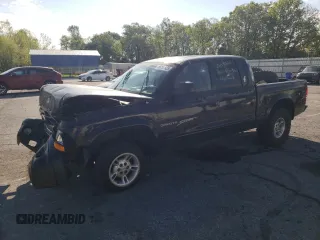 2001 Dodge Dakota Sport z VIN 1B7GG2AN31S103211, wystawiony jako Copart lot #56007935 z przebiegiem 232 474 mil mil oraz Szkoda całkowita • Salvage title. Historia ofert i sprzedaży dostępna na DreamBid. Obrazek 1.