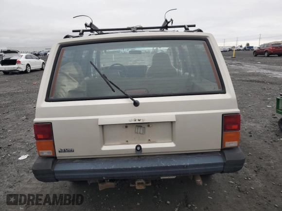 1996 Jeep Cherokee Sport with VIN 1J4FJ68S6TL112962, listed as a Copart auction lot 41540935 with 234,458 mi miles and Salvage Title. Bid and sale history available at carsss.com. Image 6.