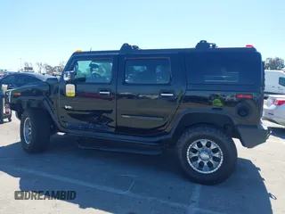 2003 Hummer H2 z VIN 5GRGN23U63H117676, wystawiony jako IAAI lot #41816411 z przebiegiem Nie podano mil oraz . Historia ofert i sprzedaży dostępna na DreamBid. Obrazek 14.