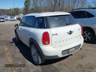 2014 MINI Countryman with VIN WMWZB3C52EWR42241, listed as a IAAI auction lot 41734963 with 121,325 mi miles and . Bid and sale history available at DreamBid. Image 3.