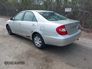 2002 Toyota Camry LE z VIN 4T1BE32K42U029129, wystawiony jako IAAI lot #42190162 z przebiegiem 191 423 mil mil oraz . Historia ofert i sprzedaży dostępna na DreamBid. Obrazek 3.