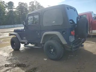 2005 Jeep Wrangler SE with VIN 1J4FA29S55P385703, listed as a Copart auction lot 81471004 with 131,065 mi miles and Salvage Title. Bid and sale history available at carsss.com. Image 2.