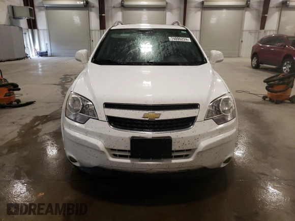 2014 Chevrolet Captiva Sport LT with VIN 3GNAL3EK4ES661268, listed as a Copart auction lot 74895224 with 128,513 mi miles and Salvage Title. Bid and sale history available at DreamBid. Image 5.