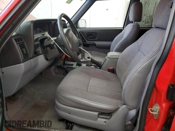 1998 Jeep Cherokee Sport with VIN 1J4FJ68S7WL148034, listed as a Copart auction lot 52436475 with 80,239 mi miles and Salvage Title. Bid and sale history available at carsss.com. Image 7.