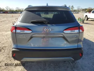 2023 Toyota Corolla Cross LE with VIN 7MUCAAAG8PV060228, listed as a Copart auction lot 86827224 with 40,395 mi miles and Salvage title. Bid and sale history available at DreamBid. Image 6.