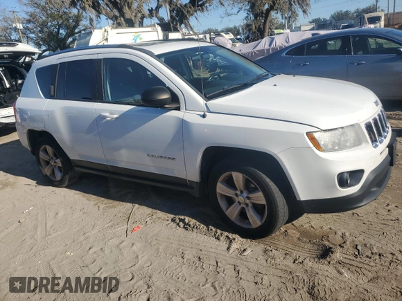 2012 Jeep Compass Latitude with VIN 1C4NJDEB4CD537763, listed as a Copart auction lot 84878244 with 198,582 mi miles and Clean Title. Bid and sale history available at DreamBid. Image 4.