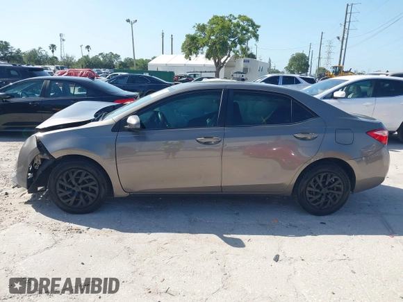 2019 Toyota Corolla L with VIN 5YFBURHE7KP878972, listed as a IAAI auction lot 42000888 with 201,612 mi miles. Bid and sale history available at carsss.com. Image 14.