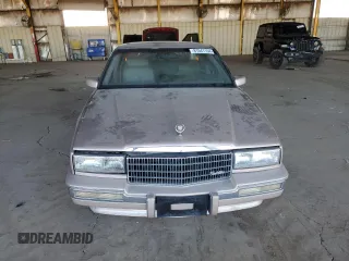 1991 Cadillac Seville z VIN 1G6KS53B5MU825563, wystawiony jako Copart lot #81541154 z przebiegiem 93 284 mil mil oraz Czysty tytuł • Clean title. Historia ofert i sprzedaży dostępna na DreamBid. Obrazek 5.