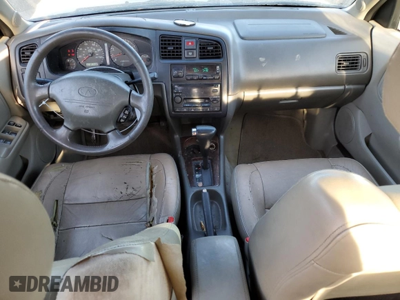 2001 Infiniti G20 Luxury z VIN JNKCP11A01T400404, wystawiony jako Copart lot #69899274 z przebiegiem 243 332 mil mil oraz Szkoda całkowita • Salvage title. Historia ofert i sprzedaży dostępna na DreamBid. Obrazek 8.