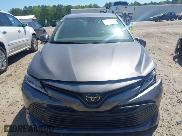 2019 Toyota Camry LE z VIN 4T1B11HK4KU797720, wystawiony jako IAAI lot #42053830 z przebiegiem 102 558 mil mil oraz . Historia ofert i sprzedaży dostępna na DreamBid. Obrazek 12.