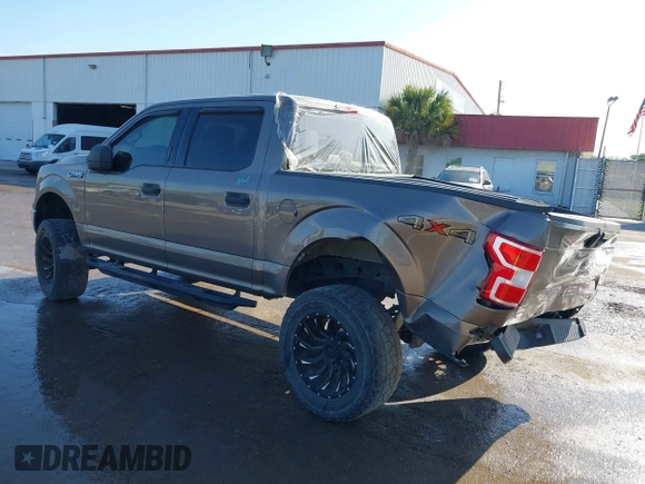 2018 Ford F-150 XL with VIN 1FTEW1EG1JFC31794, listed as a IAAI auction lot 41304111 with 129,058 mi miles and . Bid and sale history available at carsss.com. Image 3.