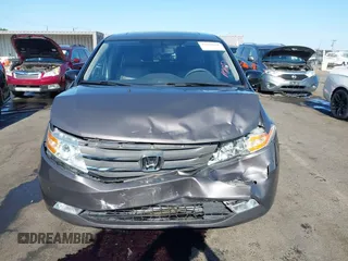 2012 Honda Odyssey Touring with VIN 5FNRL5H95CB057346, listed as a IAAI auction lot 42644094 with 114,712 mi miles and . Bid and sale history available at DreamBid. Image 13.
