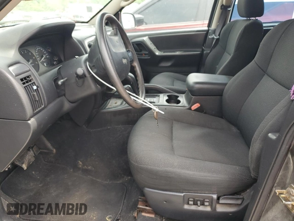 2002 Jeep Grand Cherokee Laredo with VIN 1J4GW48S02C174656, listed as a Copart auction lot 56954155 with 235,427 mi miles and Salvage title. Bid and sale history available at DreamBid. Image 7.