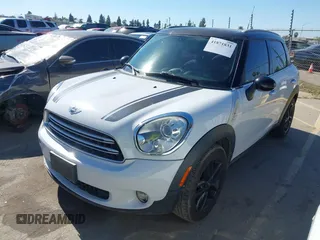 2015 MINI Countryman with VIN WMWZB3C51FWR45357, listed as a IAAI auction lot 41871831 with 201,358 mi miles and . Bid and sale history available at DreamBid. Image 2.
