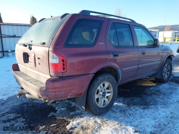 2002 Isuzu Rodeo with VIN 4S2DM58W124319936, listed as a IAAI auction lot 41555285 with 143,035 mi miles. Bid and sale history available at carsss.com. Image 4.