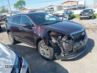 2021 Cadillac XT5 FWD Premium Luxury z VIN 1GYKNCRSXMZ118990, wystawiony jako IAAI lot #41991857 z przebiegiem 92 085 mil mil oraz . Historia ofert i sprzedaży dostępna na DreamBid. Obrazek 1.