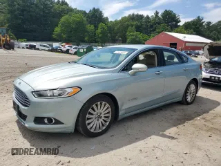 2013 Ford Fusion SE Hybrid z VIN 3FA6P0LU2DR308271, wystawiony jako Copart lot #62965605 z przebiegiem 243 414 mil mil oraz Czysty tytuł • Clean title. Historia ofert i sprzedaży dostępna na DreamBid. Obrazek 1.