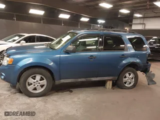 2009 Ford Escape XLT with VIN 1FMCU93G99KB70918, listed as a IAAI auction lot 41942399 with 141,158 mi miles. Bid and sale history available at carsss.com. Image 14.