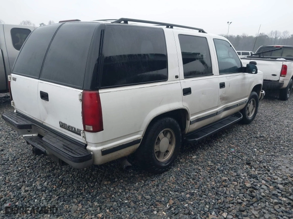 1999 Chevrolet Tahoe with VIN 1GNEC13RXXR101766, listed as a IAAI auction lot 41393447 with 387,448 mi miles. Bid and sale history available at carsss.com. Image 4.
