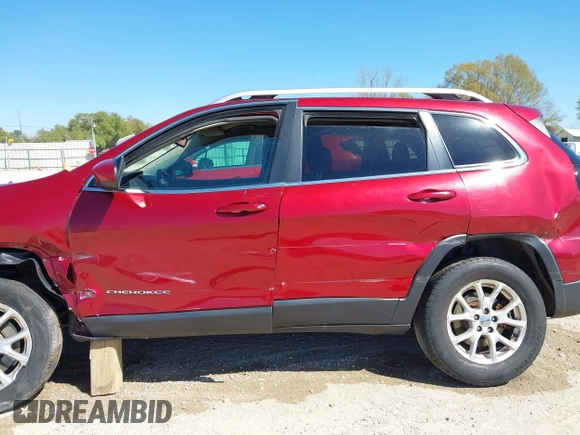 2015 Jeep Cherokee North with VIN 1C4PJMCSXFW654090, listed as a IAAI auction lot 41844434 with 198,592 mi miles. Bid and sale history available at carsss.com. Image 14.