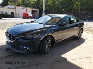 2016 Mazda Mazda6 i Grand Touring with VIN JM1GJ1W52G1430377, listed as a Copart auction lot 70019244 with 197,317 mi miles and Salvage Title. Bid and sale history available at carsss.com. Image 1.