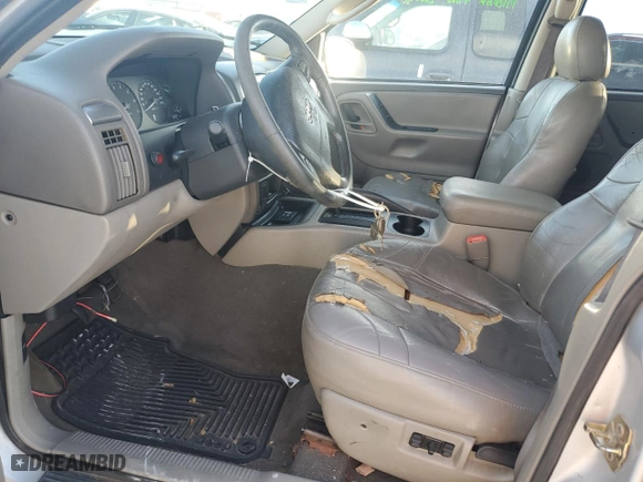 2004 Jeep Grand Cherokee Laredo with VIN 1J4GX48N74C406647, listed as a Copart auction lot 77631654 with 174,824 mi miles and Salvage Title. Bid and sale history available at carsss.com. Image 7.