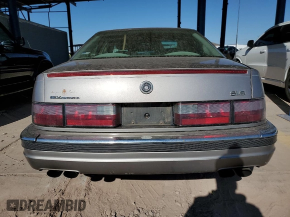 1997 Cadillac Seville Luxury SLS z VIN 1G6KS52Y5VU815770, wystawiony jako Copart lot #88555205 z przebiegiem 92 459 mil mil oraz Czysty tytuł • Clean title. Historia ofert i sprzedaży dostępna na DreamBid. Obrazek 6.
