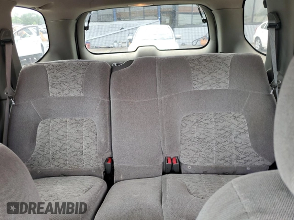2003 GMC Envoy SLE z VIN 1GKDT13S432160651, wystawiony jako Copart lot #56938205 z przebiegiem 197 593 mil mil oraz Szkoda całkowita • Salvage title. Historia ofert i sprzedaży dostępna na DreamBid. Obrazek 10.