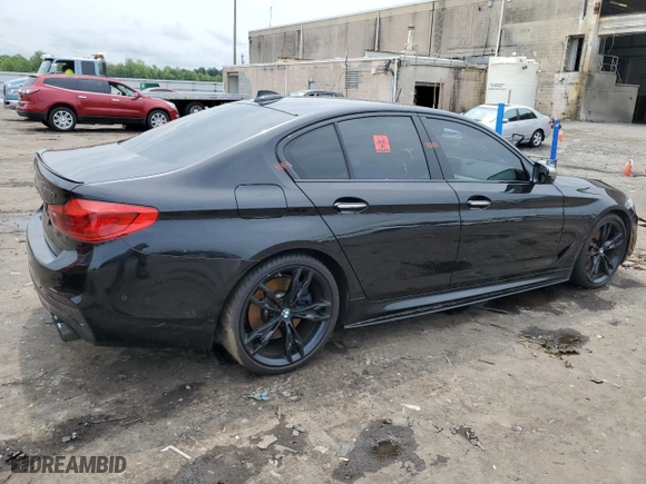 2018 BMW 5 Series M550i xDrive with VIN WBAJB9C51JB286700, listed as a Copart auction lot 64681004 with 76,304 mi miles and Salvage Title. Bid and sale history available at carsss.com. Image 3.