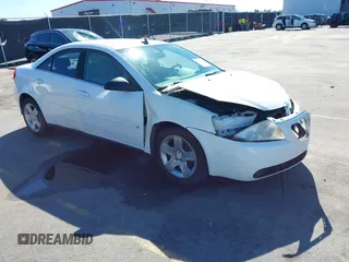 2009 Pontiac G6 w/1SA *Ltd Avail* with VIN 1G2ZG57B994169306, listed as a IAAI auction lot 41747212 with 124,298 mi miles. Bid and sale history available at carsss.com. Image 1.