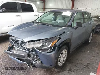 2022 Toyota Corolla Cross L with VIN 7MUAAAAG9NV034659, listed as a IAAI auction lot 42125356 with 14,631 mi miles and . Bid and sale history available at DreamBid. Image 2.