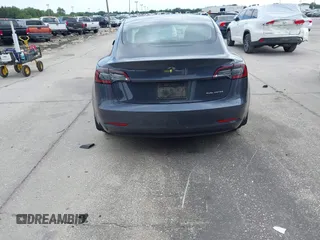 2021 Tesla Model 3 Long Range with VIN 5YJ3E1EB4MF855581, listed as a IAAI auction lot 41974515 with 71,561 mi miles. Bid and sale history available at carsss.com. Image 16.
