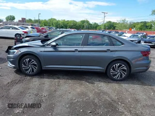 2020 Volkswagen Jetta SEL z VIN 3VWEB7BU2LM024016, wystawiony jako IAAI lot #42341318 z przebiegiem 40 480 mil mil oraz . Historia ofert i sprzedaży dostępna na DreamBid. Obrazek 14.