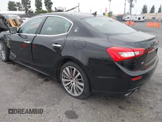 2015 Maserati Ghibli z VIN ZAM57XSA4F1151843, wystawiony jako IAAI lot #38392898 z przebiegiem 88 147 mil mil oraz . Historia ofert i sprzedaży dostępna na DreamBid. Obrazek 3.