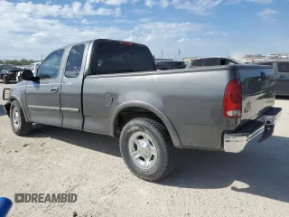 2003 Ford F-150 XL with VIN 1FTRX17L33NB34789, listed as a Copart auction lot 73762304 with 0 mi miles and Salvage Title. Bid and sale history available at carsss.com. Image 2.