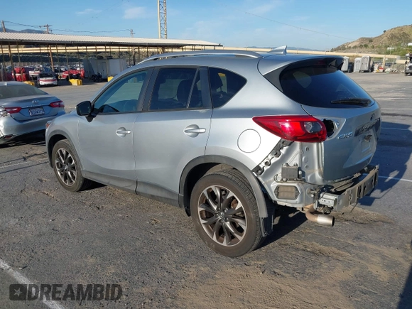 2016 Mazda CX-5 Grand Touring z VIN JM3KE2DY8G0709573, wystawiony jako IAAI lot #42021005 z przebiegiem 113 941 mil mil oraz . Historia ofert i sprzedaży dostępna na DreamBid. Obrazek 3.