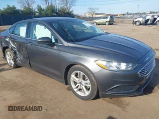 2018 Ford Fusion SE z VIN 3FA6P0H79JR284534, wystawiony jako IAAI lot #42074862 z przebiegiem 77 321 mil mil oraz . Historia ofert i sprzedaży dostępna na DreamBid. Obrazek 1.