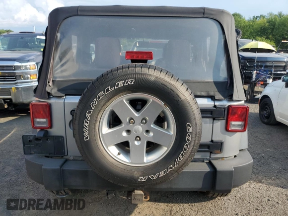 2013 Jeep Wrangler Sport with VIN 1C4AJWAG7DL635639, listed as a Copart auction lot 67182975 with 101,576 mi miles and Clean title. Bid and sale history available at DreamBid. Image 6.