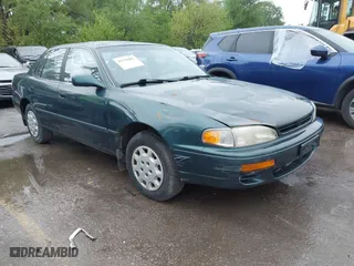 1996 Toyota Camry DX with VIN JT2BG12K5T0346311, listed as a IAAI auction lot 42130482 with 214,872 mi miles. Bid and sale history available at carsss.com. Image 1.