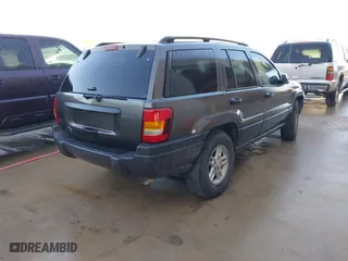 2004 Jeep Grand Cherokee Laredo with VIN 1J4GX48S04C394024, listed as a IAAI auction lot 41982608 with 142,825 mi miles. Bid and sale history available at carsss.com. Image 4.