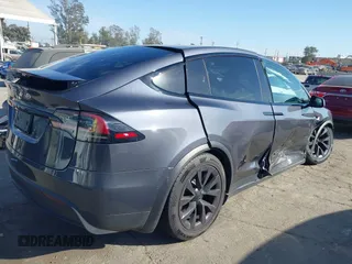 2023 Tesla Model X with VIN 7SAXCBE50PF378548, listed as a IAAI auction lot 41698357 with Not Provided miles and . Bid and sale history available at DreamBid. Image 4.