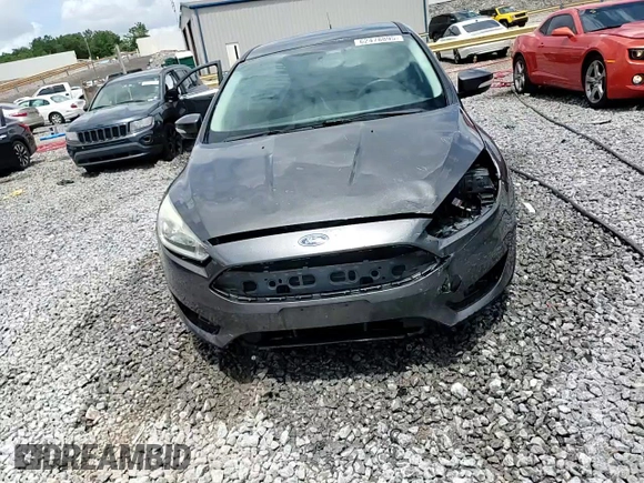 2015 Ford Focus Titanium z VIN 1FADP3N28FL239706, wystawiony jako Copart lot #62478895 z przebiegiem 143 536 mil mil oraz Szkoda całkowita • Salvage title. Historia ofert i sprzedaży dostępna na DreamBid. Obrazek 14.